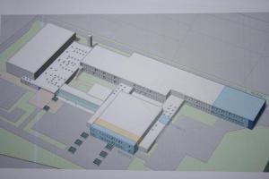Die Flächen der Schule, die erweitert werden sollen, sind in diesem Entwurf des Architekten Jan Braker blau gekennzeichnet. Quelle: Jan Braker